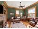 Inviting living room with a cozy fireplace, hardwood floors, and ample natural light at 1352 Clinton St, Noblesville, IN 46060