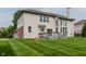 Home featuring a large backyard, deck, and lush green lawn at 13693 Cunningham Dr, Carmel, IN 46074