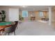 Spacious finished basement offers a game table, natural light, and ample room for recreation and relaxation at 13693 Cunningham Dr, Carmel, IN 46074