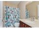 Bathroom featuring a vanity with solid surface counters and a shower with tub at 13693 Cunningham Dr, Carmel, IN 46074