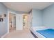 Bright bedroom featuring a bed and white doors leading to other rooms at 13693 Cunningham Dr, Carmel, IN 46074