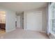 Bright bedroom featuring a large closet with sliding doors and a window providing natural light at 13693 Cunningham Dr, Carmel, IN 46074