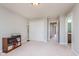 Bright bedroom features neutral walls, plush carpeting, and large closet space at 13693 Cunningham Dr, Carmel, IN 46074
