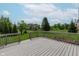 Deck overlooking a scenic backyard and lush green spaces at 13693 Cunningham Dr, Carmel, IN 46074