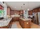 Gourmet kitchen with granite countertops, stainless steel appliances, and a central island at 13693 Cunningham Dr, Carmel, IN 46074