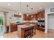 Well-equipped kitchen with wooden cabinets, an island, and modern appliances at 13693 Cunningham Dr, Carmel, IN 46074