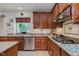 Spacious kitchen with granite countertops, stainless steel appliances, and ample storage at 13693 Cunningham Dr, Carmel, IN 46074