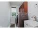 Functional laundry room with modern washer and dryer and a utility sink at 13693 Cunningham Dr, Carmel, IN 46074