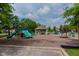 Community playground with slides, swings, and a covered picnic area at 13693 Cunningham Dr, Carmel, IN 46074