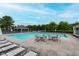 Community pool featuring lounge chairs, tables, and a covered gazebo area at 13693 Cunningham Dr, Carmel, IN 46074