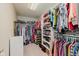 Spacious walk-in closet with ample shelving and hanging space for organized storage at 13693 Cunningham Dr, Carmel, IN 46074