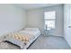 Cozy bedroom features carpet, white walls, window, and a glass side table at 1529 Fairmount Dr, Greenfield, IN 46140