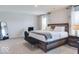 Bedroom with a plush bed, neutral colors, and natural light from the windows at 1529 Fairmount Dr, Greenfield, IN 46140