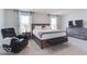 Bedroom features a bed, chair, dresser, and great natural lighting from two windows at 1529 Fairmount Dr, Greenfield, IN 46140