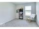 Bedroom with a chair, athletic gear, and natural light from the window at 1529 Fairmount Dr, Greenfield, IN 46140