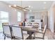 Bright dining area with modern lighting, stainless appliances, and easy kitchen access at 1529 Fairmount Dr, Greenfield, IN 46140