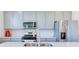 Kitchen with stainless steel appliances, grey cabinets, and quartz countertops at 1529 Fairmount Dr, Greenfield, IN 46140