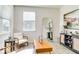 Bright living room with a large window, neutral decor, and stylish furniture at 1529 Fairmount Dr, Greenfield, IN 46140