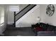 Cozy living room featuring staircase, comfortable seating, and stylish decor at , Indianapolis, IN 46220