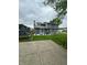 Large open backyard features an established lawn, patio, and play area at 1831 Beckenbauer Ln, Indianapolis, IN 46214