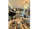 Sophisticated dining room showcases a zebra-striped table runner and modern chandelier at 1831 Beckenbauer Ln, Indianapolis, IN 46214