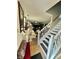 Bright foyer view showcasing the staircase and a glimpse into the stylish living room with white and neutral tones at 1831 Beckenbauer Ln, Indianapolis, IN 46214