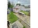 Backyard playhouse with a small porch and table for Gathering fun at 1831 Beckenbauer Ln, Indianapolis, IN 46214