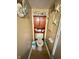 Compact yet functional toilet room with a decorative cabinet and seaside-themed accents at 1831 Beckenbauer Ln, Indianapolis, IN 46214