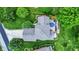 An eye-level aerial view of a home showing the roof and a well-manicured lawn, showcasing backyard patio at 1850 Longest Dr, Franklin, IN 46131