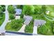 An aerial view showcases a home's location within a verdant neighborhood, close to a golf course at 1850 Longest Dr, Franklin, IN 46131
