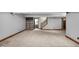 Finished basement includes built-in bookcase, carpeted floors, and is freshly painted in neutral colors at 1850 Longest Dr, Franklin, IN 46131