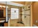 Bathroom boasting a glass shower with rainfall showerhead and bench, and a granite-topped vanity at 1850 Longest Dr, Franklin, IN 46131