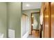 Bathroom featuring a glass shower door, wood cabinets and trim, and green-painted walls at 1850 Longest Dr, Franklin, IN 46131