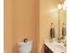 Powder room featuring a toilet, vanity with a marble countertop, and modern fixtures at 1850 Longest Dr, Franklin, IN 46131