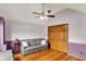 Bedroom offering wood floors, a gray sofa, and ample natural light from its vaulted ceilings at 1850 Longest Dr, Franklin, IN 46131