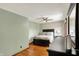 Cozy bedroom with ceiling fan, wood floors, and a comfortable bed at 1850 Longest Dr, Franklin, IN 46131