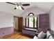 Bedroom featuring wood floors, a gray sofa, vaulted ceilings and custom built-in shelves at 1850 Longest Dr, Franklin, IN 46131
