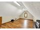 Spacious bonus room with plenty of natural light, hard floors, and a high ceiling at 1850 Longest Dr, Franklin, IN 46131