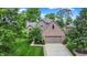 Charming brick home with a well-maintained lawn and mature trees providing ample shade at 1850 Longest Dr, Franklin, IN 46131