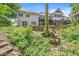 Exterior view of a home with a raised backyard and lush greenery at 18514 Oriental Oak Ct, Noblesville, IN 46062