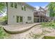 The backyard includes a patio, a retaining wall, garden beds and lawn at 18514 Oriental Oak Ct, Noblesville, IN 46062