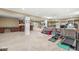 Large open basement with neutral colors, exercise equipment, living room area, and wet bar at 18514 Oriental Oak Ct, Noblesville, IN 46062