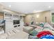 Bright basement living area with built-in shelving, comfortable seating, and neutral decor at 18514 Oriental Oak Ct, Noblesville, IN 46062