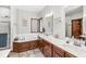 Bathroom featuring marble countertops, wood cabinets, a soaking tub, and a separate walk-in shower at 18514 Oriental Oak Ct, Noblesville, IN 46062