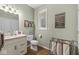 Small bathroom includes vanity, toilet and storage at 18514 Oriental Oak Ct, Noblesville, IN 46062