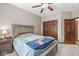 Bedroom featuring carpet floors, a ceiling fan, a full-sized bed, and wood closets at 18514 Oriental Oak Ct, Noblesville, IN 46062