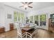 Bright dining area features wood table, white chairs, and access to outdoor living space at 18514 Oriental Oak Ct, Noblesville, IN 46062