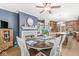 Inviting dining room showcases blue accent wall, fireplace, and view to the gourmet kitchen at 18514 Oriental Oak Ct, Noblesville, IN 46062