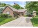 Charming brick home featuring mature trees, lush landscaping, and a welcoming front entrance at 18514 Oriental Oak Ct, Noblesville, IN 46062