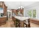 Spacious kitchen features an island with seating, hardwood floors and ample counter space at 18514 Oriental Oak Ct, Noblesville, IN 46062